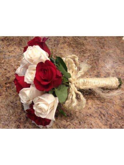 Bouquet of red and white roses with a rustic twine wrap.