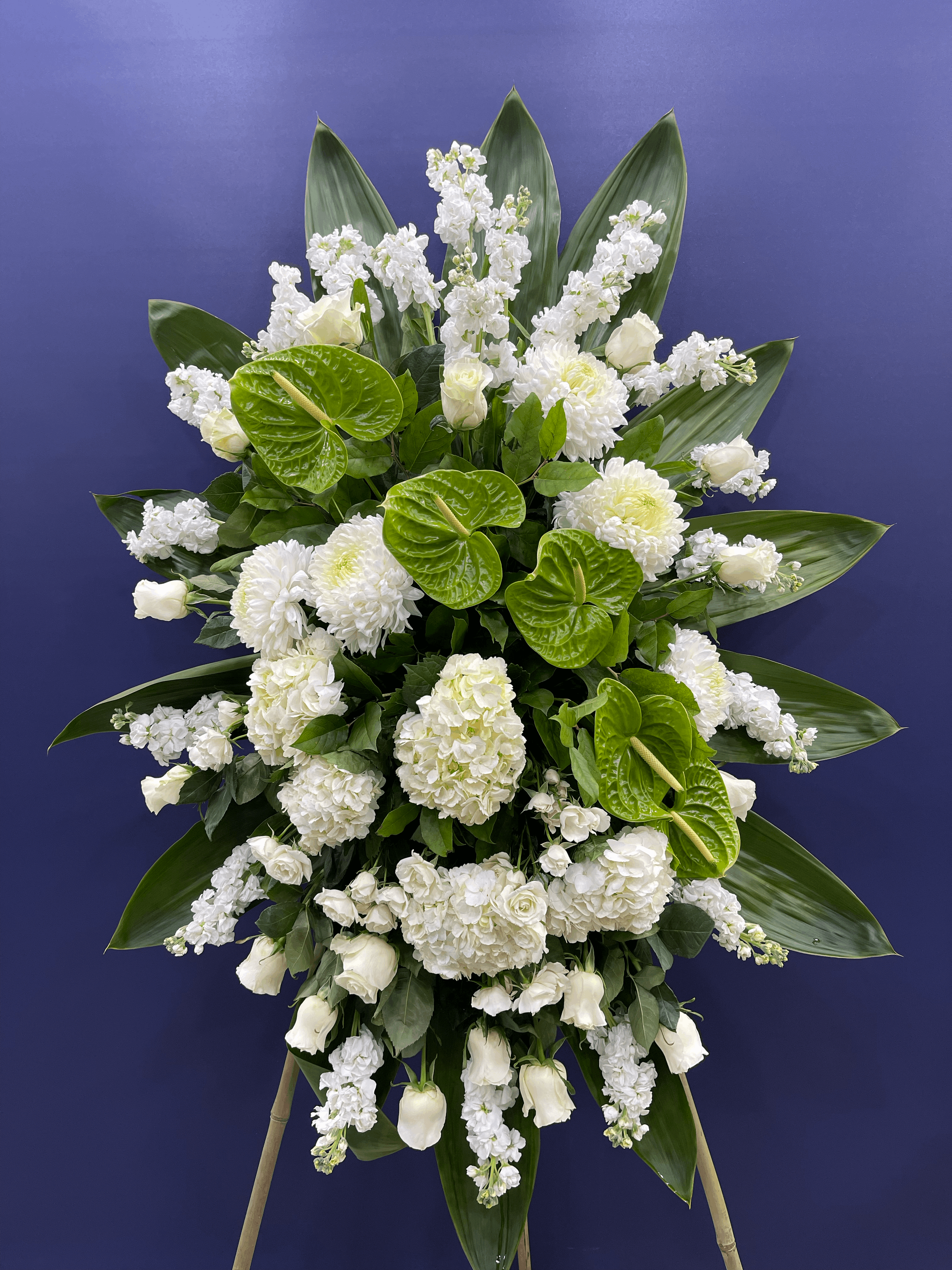 White Silence Standing Spray White rose standing spray for funeral & sympathy — Flower Empire Aurora florist serving Newmarke