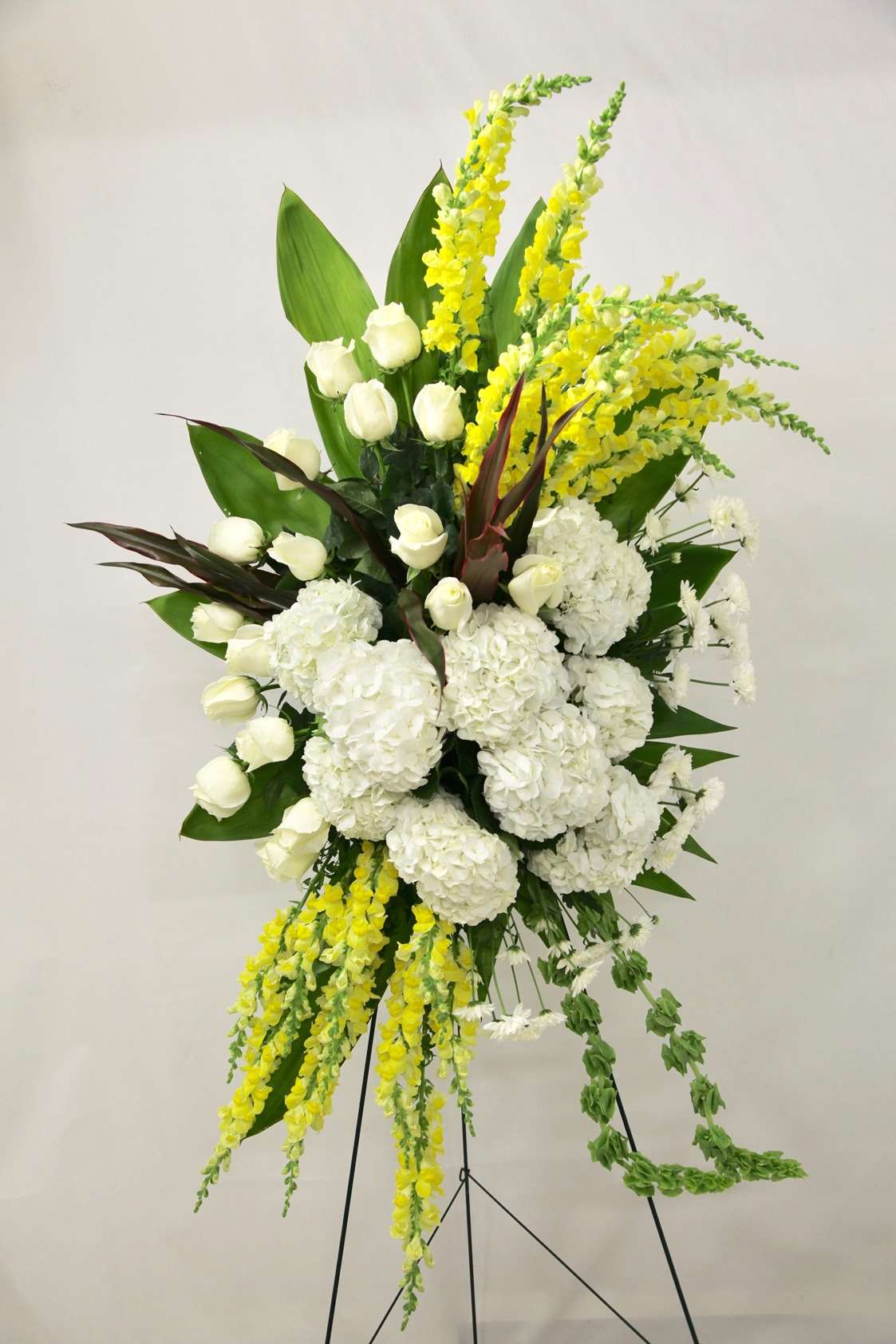 Bring Down The Sun Spary White rose floral arrangement for funeral & sympathy — Flower Empire Aurora florist serving Scarboro
