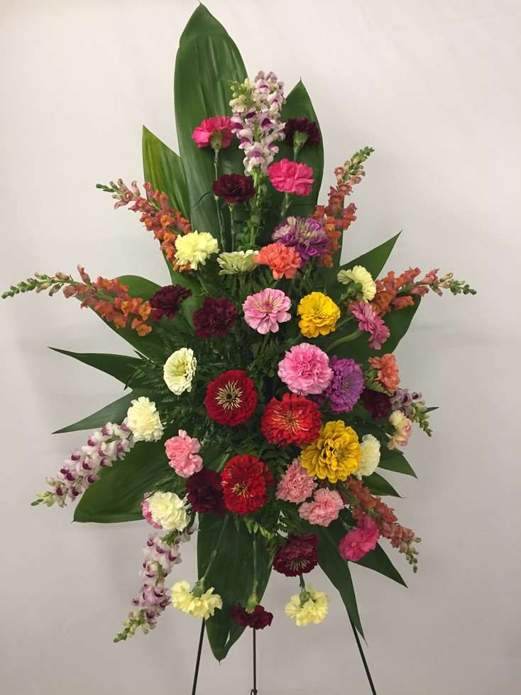 Sincerity Standing Spray Mixed Color carnation standing spray for funeral & sympathy — Flower Empire Aurora florist serving M