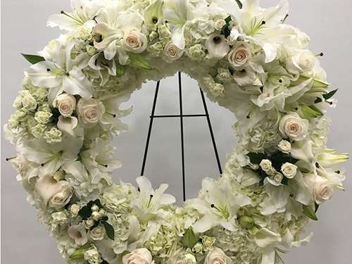 Forever Wreath Arrangement White rose wreath for funeral & sympathy — Flower Empire Aurora florist serving Brampton