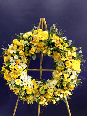Yellow Standing Wreath White orchid standing wreath for funeral & sympathy — Flower Empire Aurora florist serving North York
