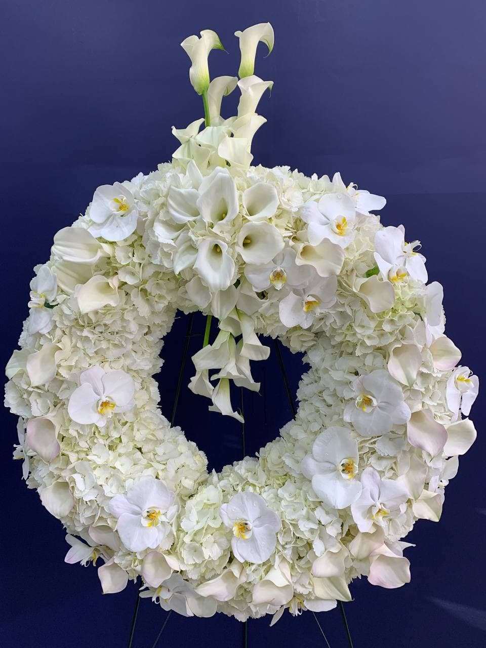 Angel in the Sky Standing Wreath Spray White orchid standing wreath for funeral & sympathy — Flower Empire Aurora florist ser