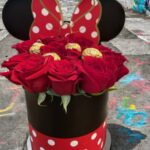 Themed Minnie Mouse box arrangement of red roses and Ferrero Rocher chocolates by Flower Empire.