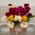 Red, white, yellow, and pink roses with white carnations in a pink gift box — Flower Empire.