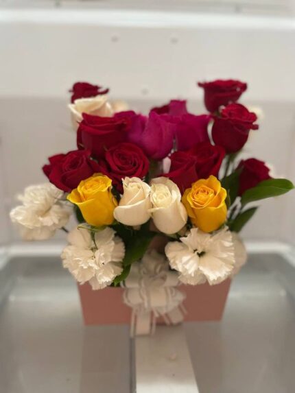 Red, white, yellow, and pink roses with white carnations in a pink gift box — Flower Empire.