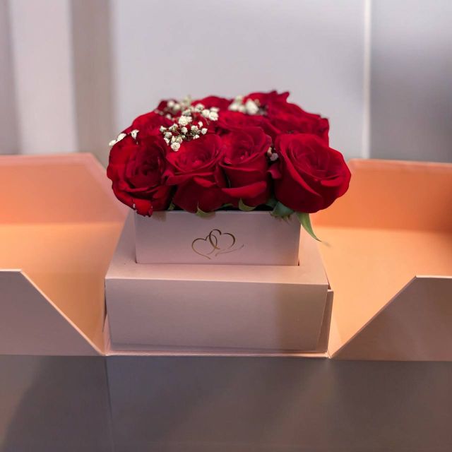 Red Rose White Heart Box Arrangement Red roses and baby's breath in a white heart-embossed gift box — perfect for romance, by Flower Empire.