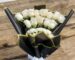 Elegant white-rose bouquet with black and gold wrapping paper — sympathy or wedding style by Flower Empire.