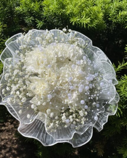 White carnation and baby's breath lace posy with pearl-style accents