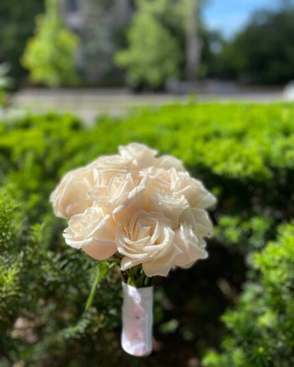 Ivory rose bridesmaid posy with pearl-style accents and decorative lace