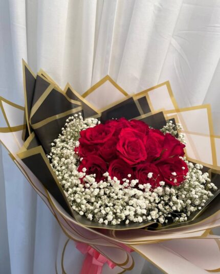 Red rose halo bouquet with baby's breath and gold-edged wrapping